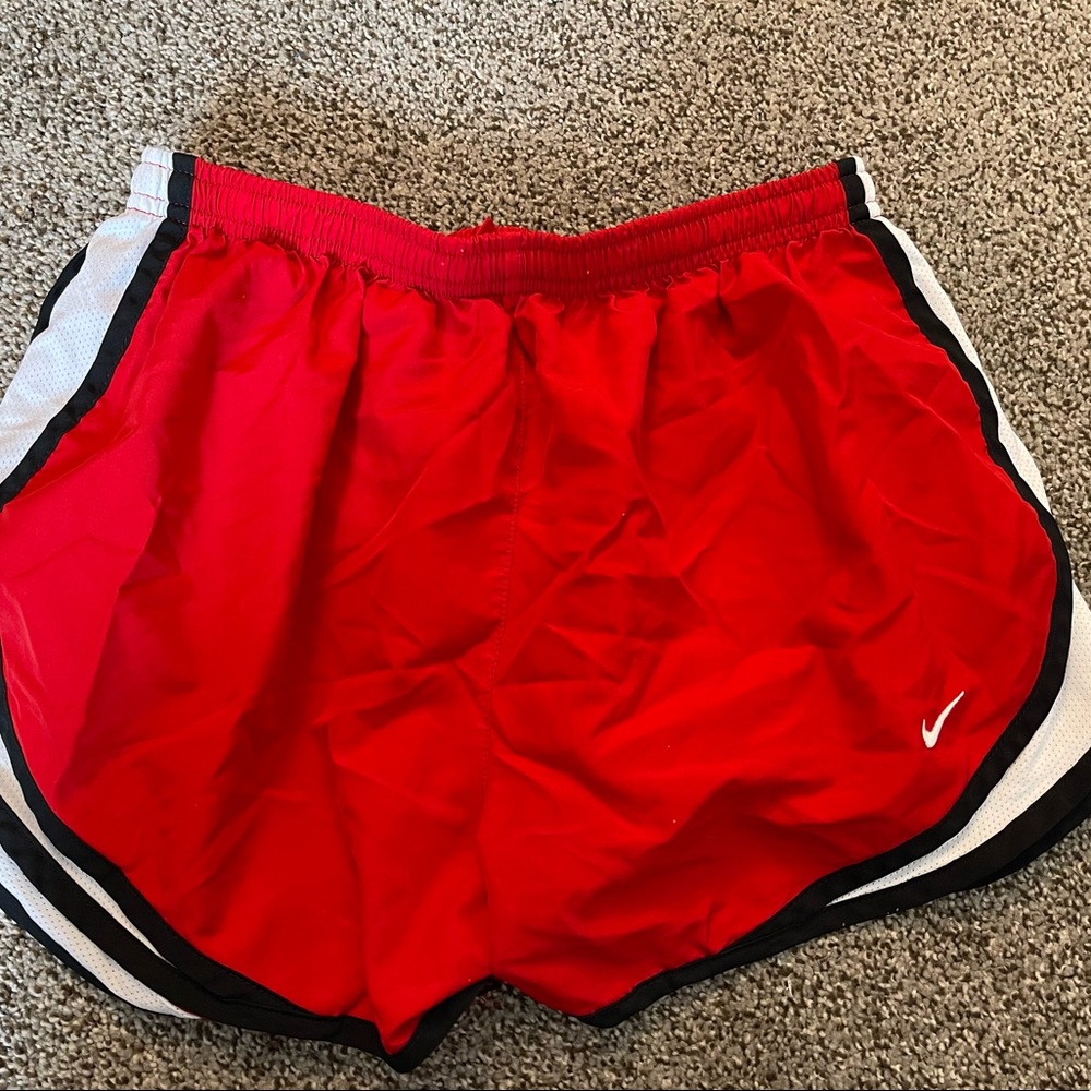 Red Nike dri-fit athletic shorts